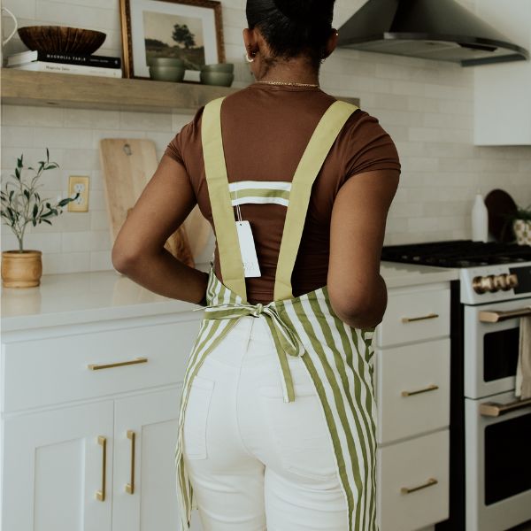 the back of green apron with white stripes