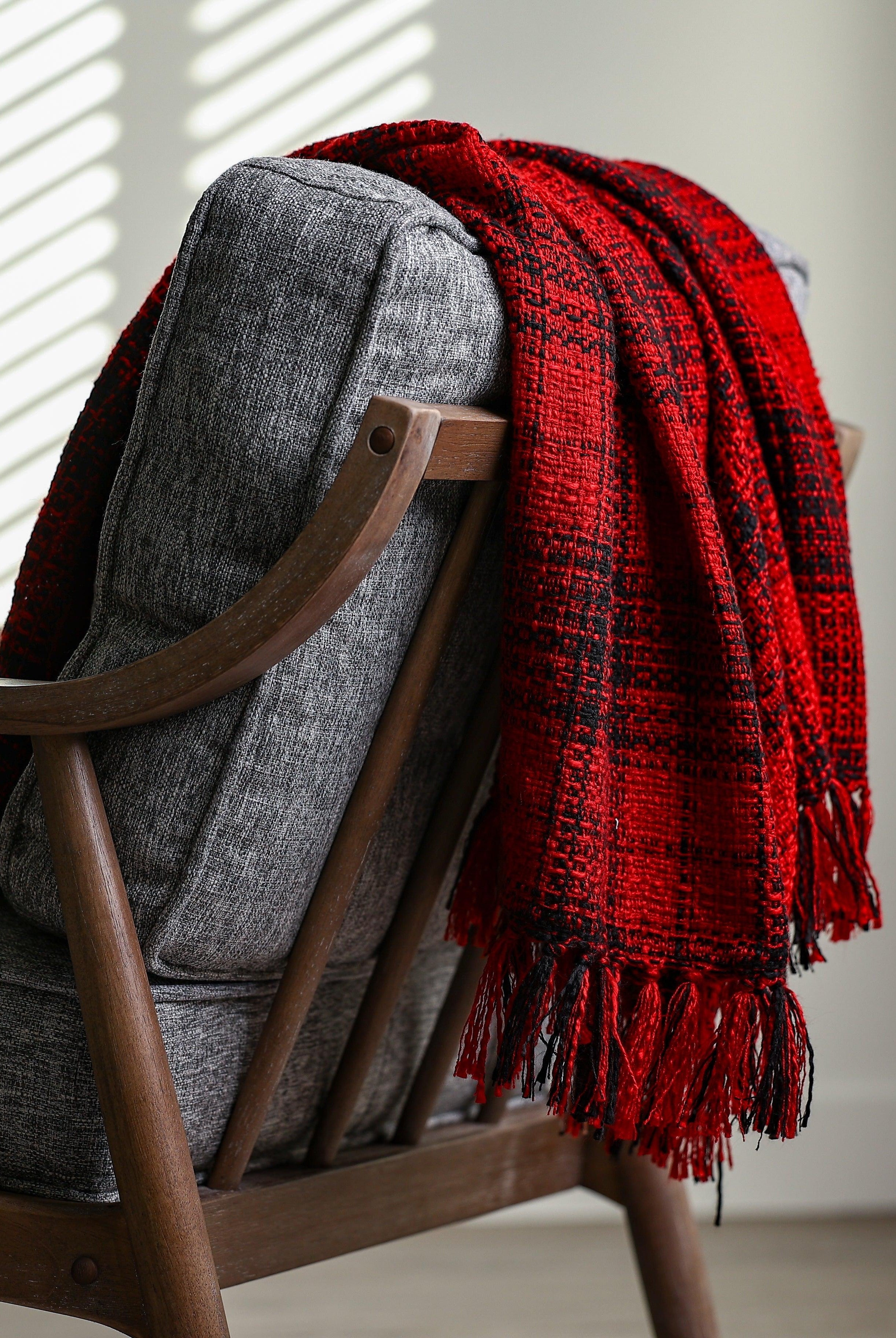bland and red plaid throw blanket