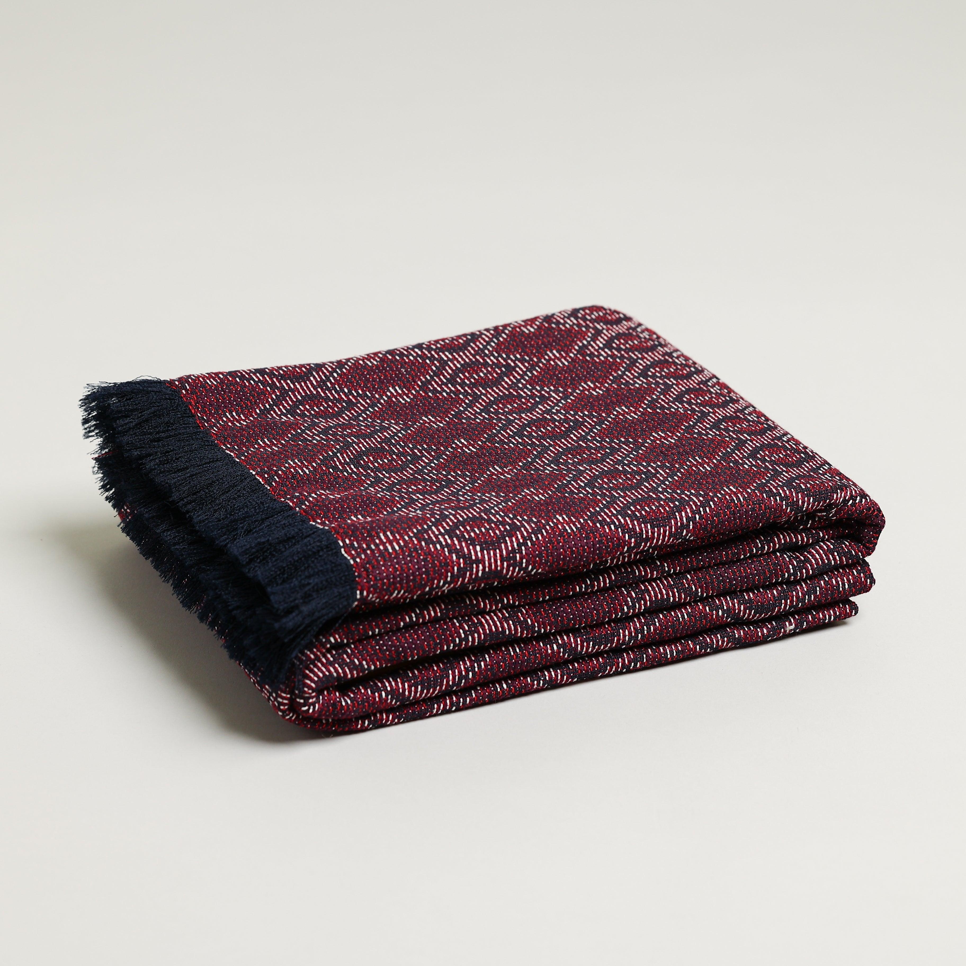 Maroon, navy, and white jacquard throw blanket 