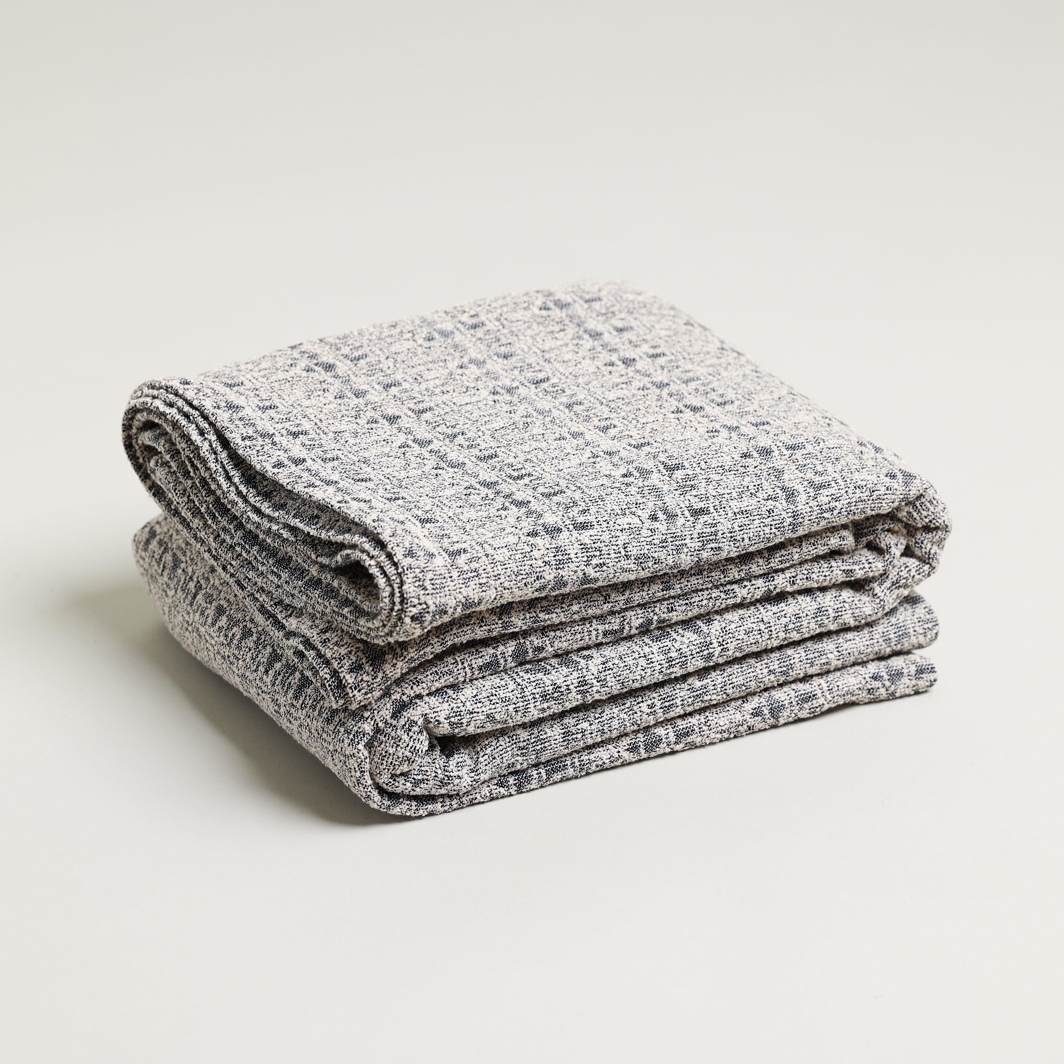 Grey and white boucle jacquard throw blanket