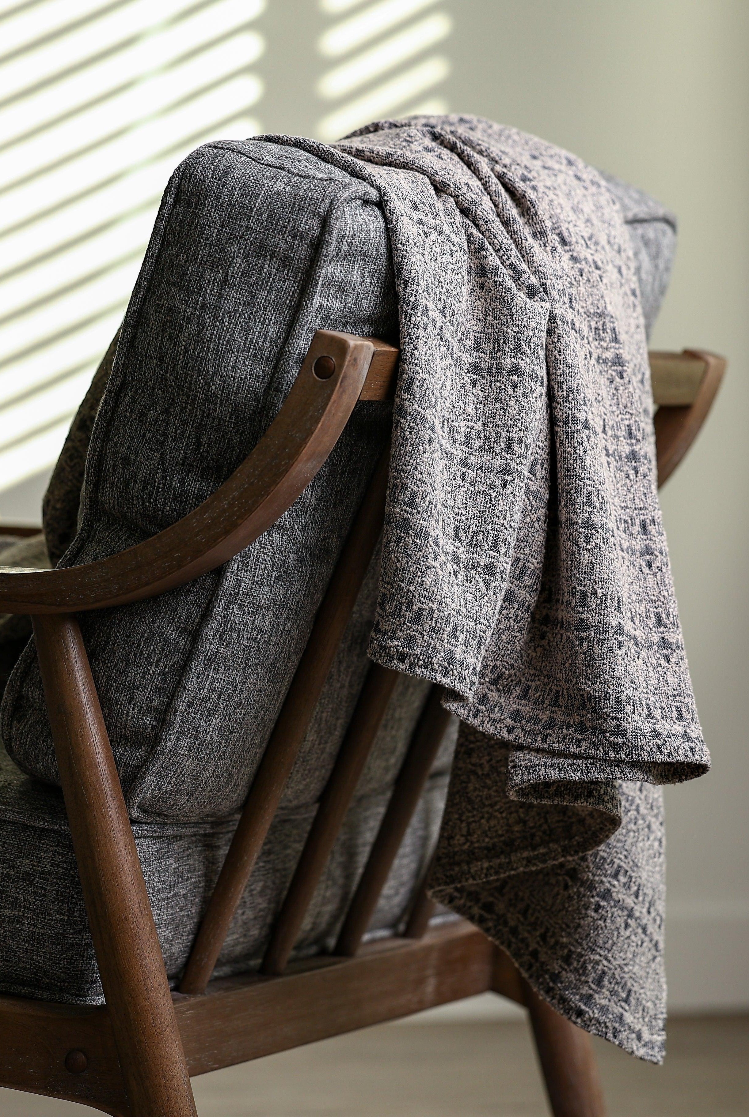 Black and grey boucle jacquard throw blanket