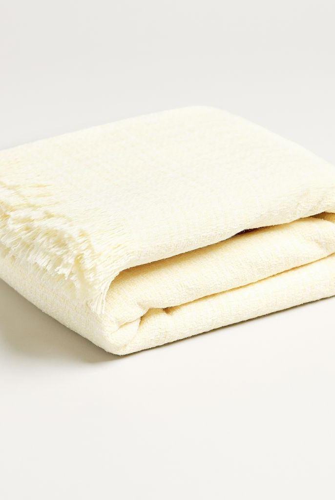 pale yellow throw blanket