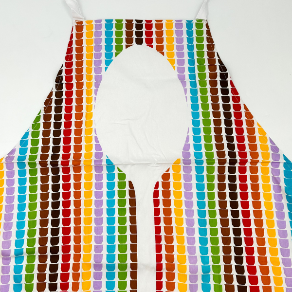 child rainbow apron with a spoon design