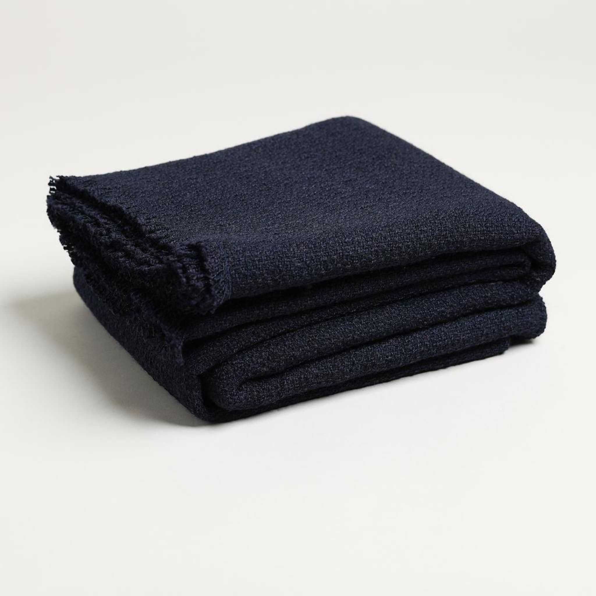 navy colored blue throw blanket folded up product image