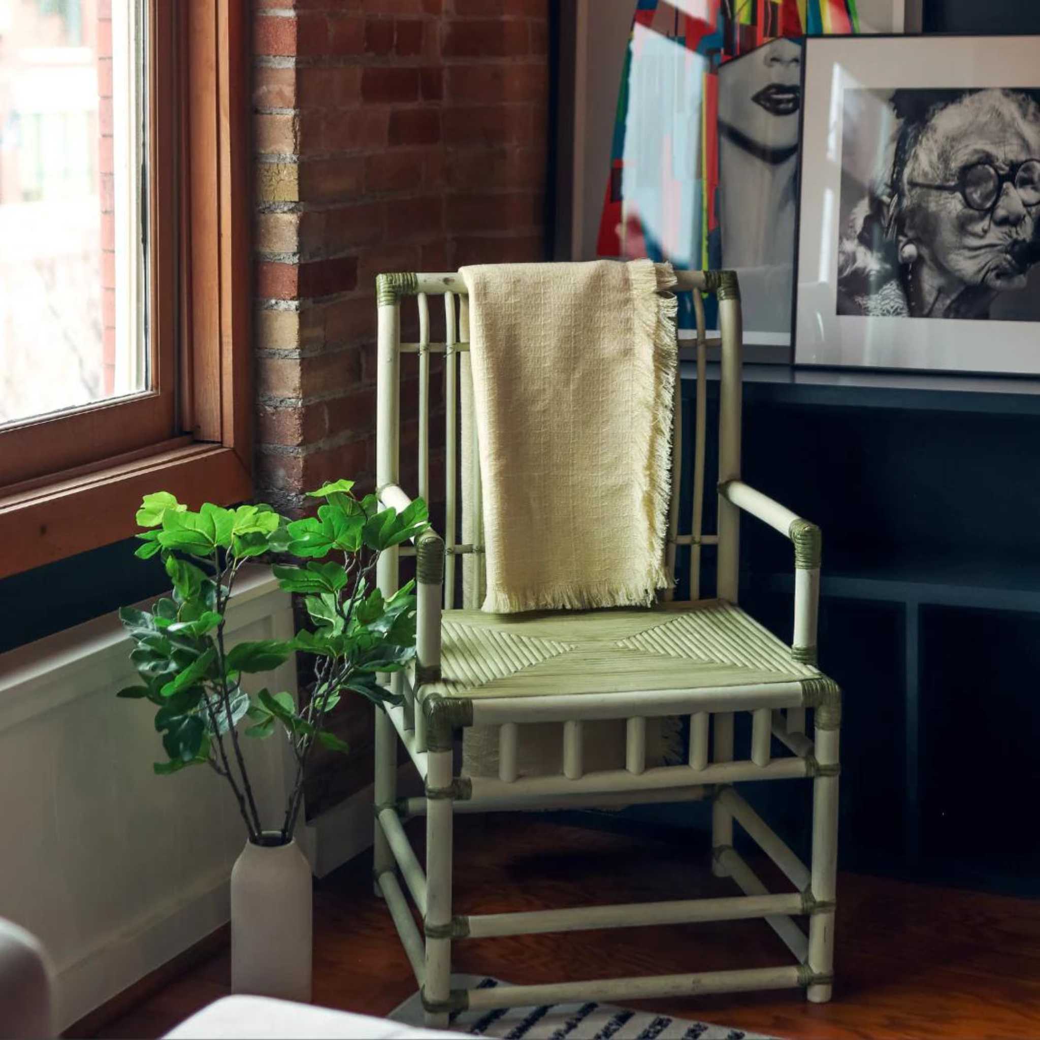 Acrylic yellow pale throw blanket styled over a chair