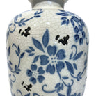 this is a detailed image of a porcelain flower vase with decorative living room decor 