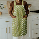 green apron with white polka dots