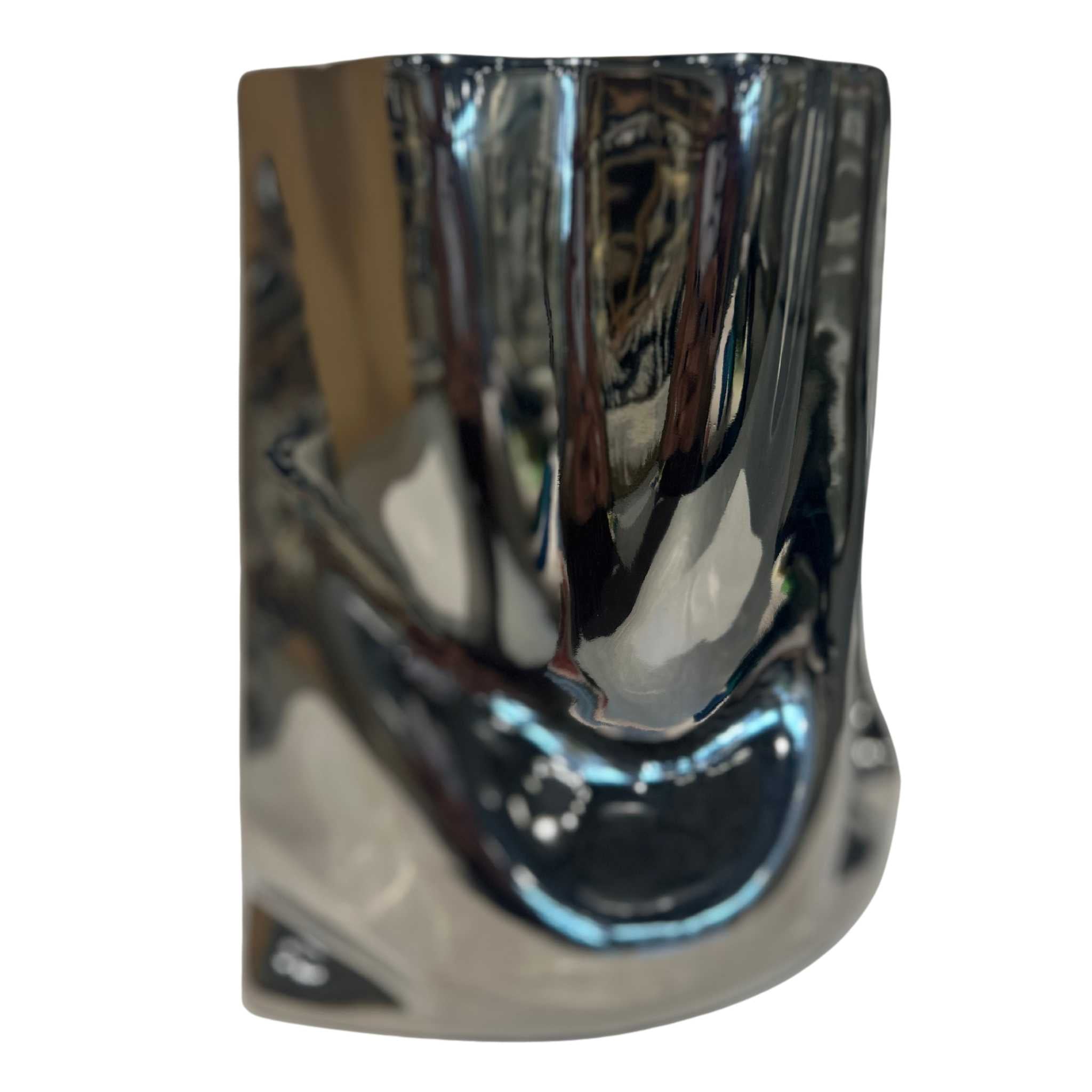 slightly angled ceramic silver shiny vase with ruffled texture