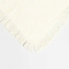 light yellow fringed throw blanket image  styled to show the weave texture and colors