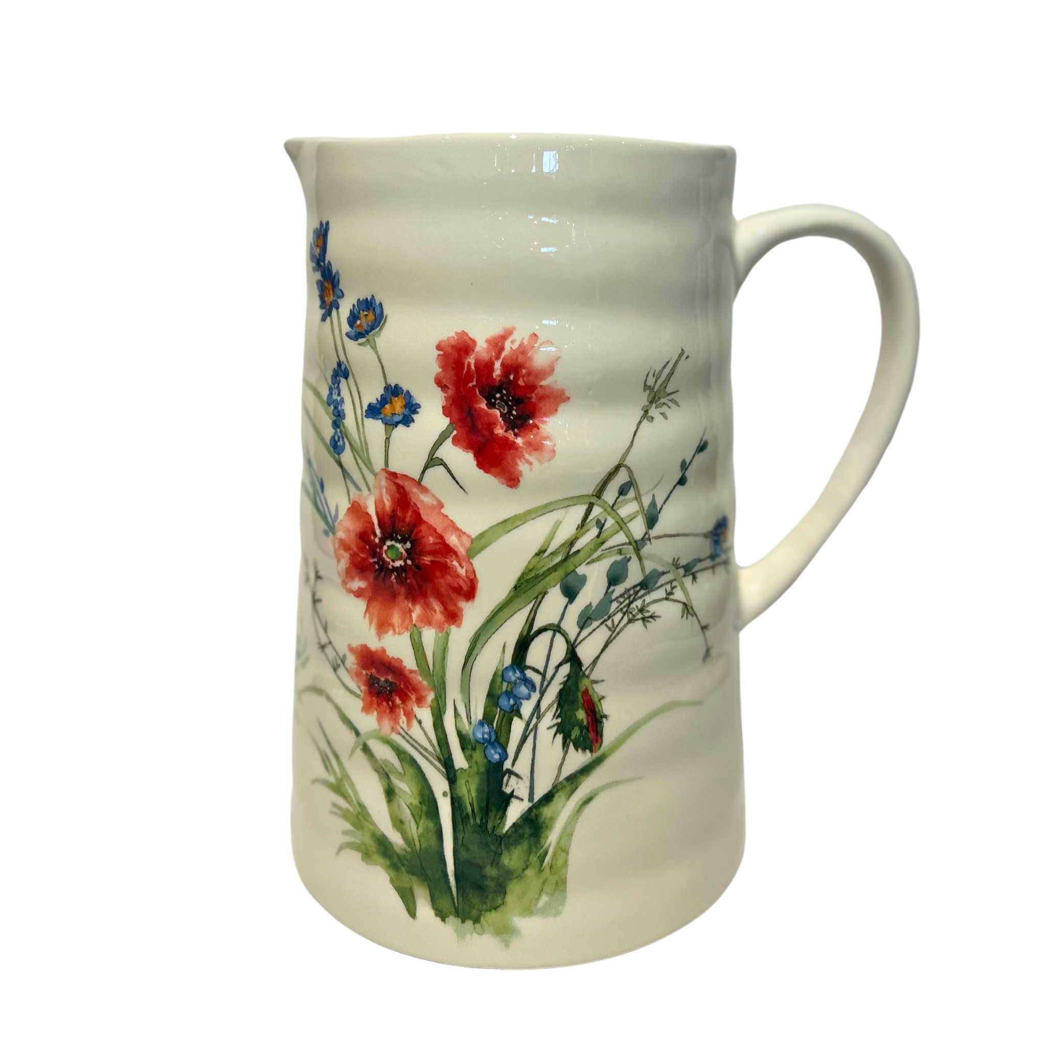 white pitcher with red wildflowers